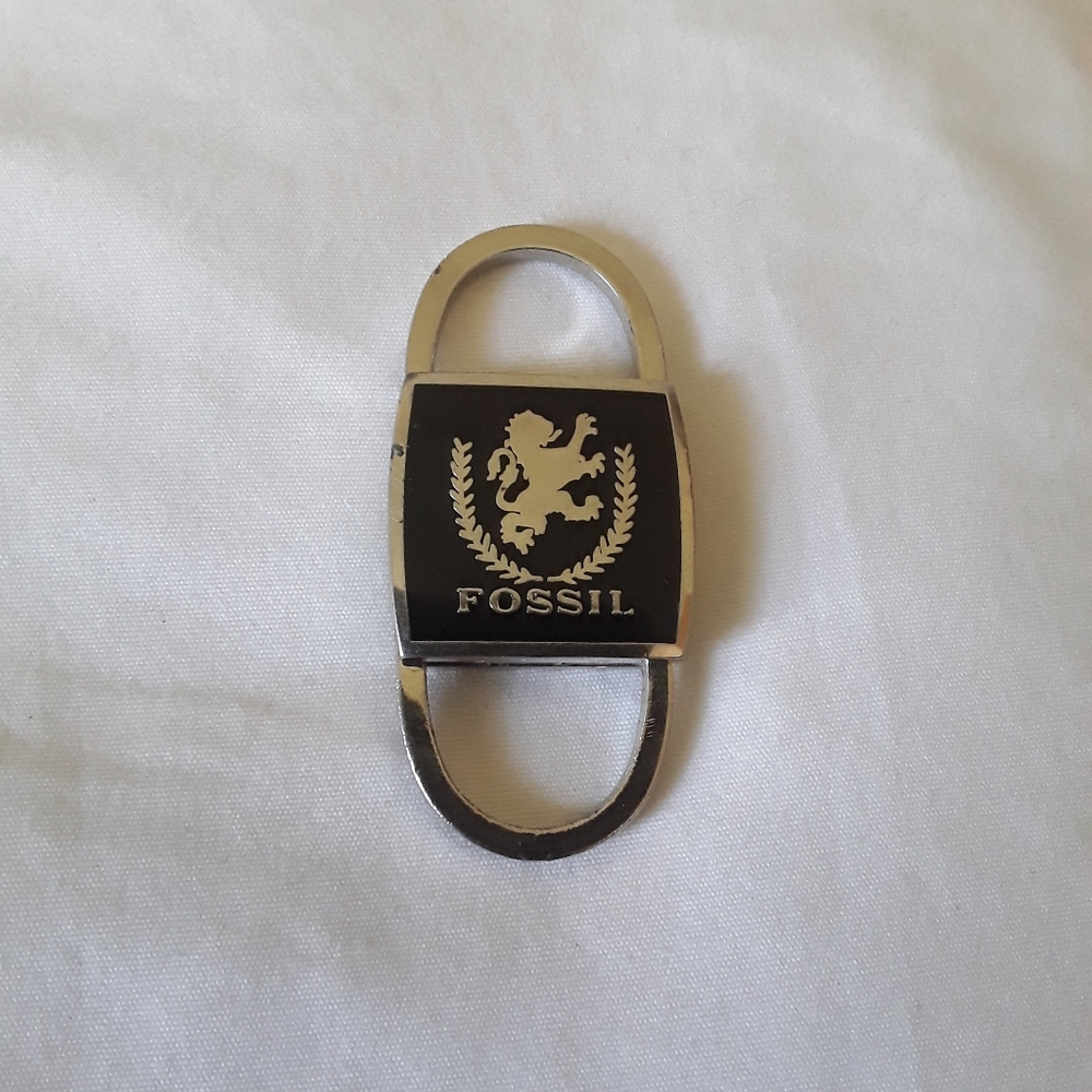 Vintage/Fossil keychain/black on silver/pull outs on top and bottom/2 1/2 inches
